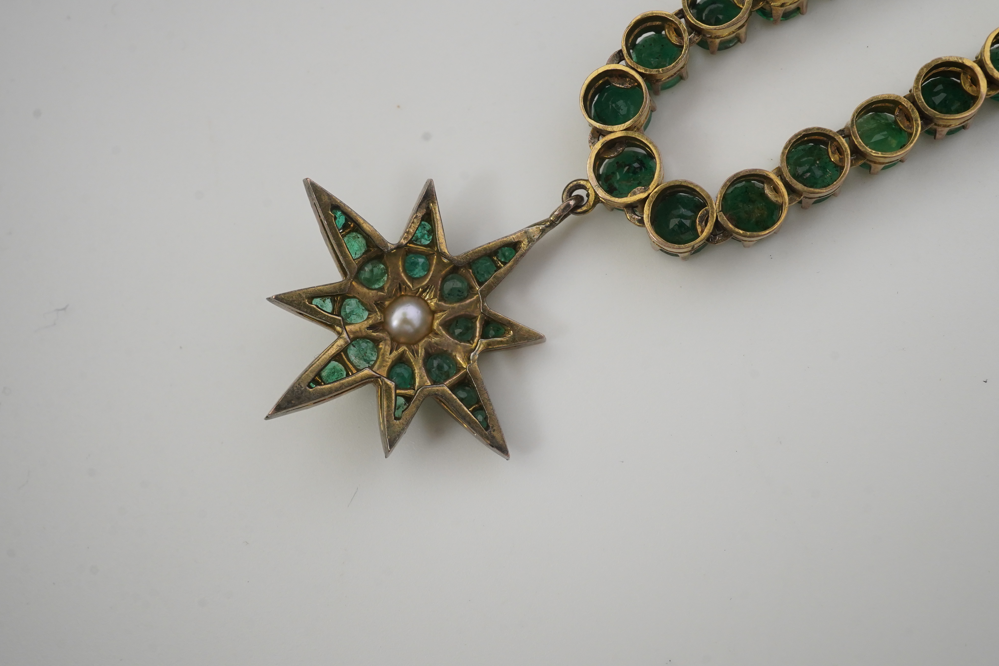 An emerald and pearl necklace